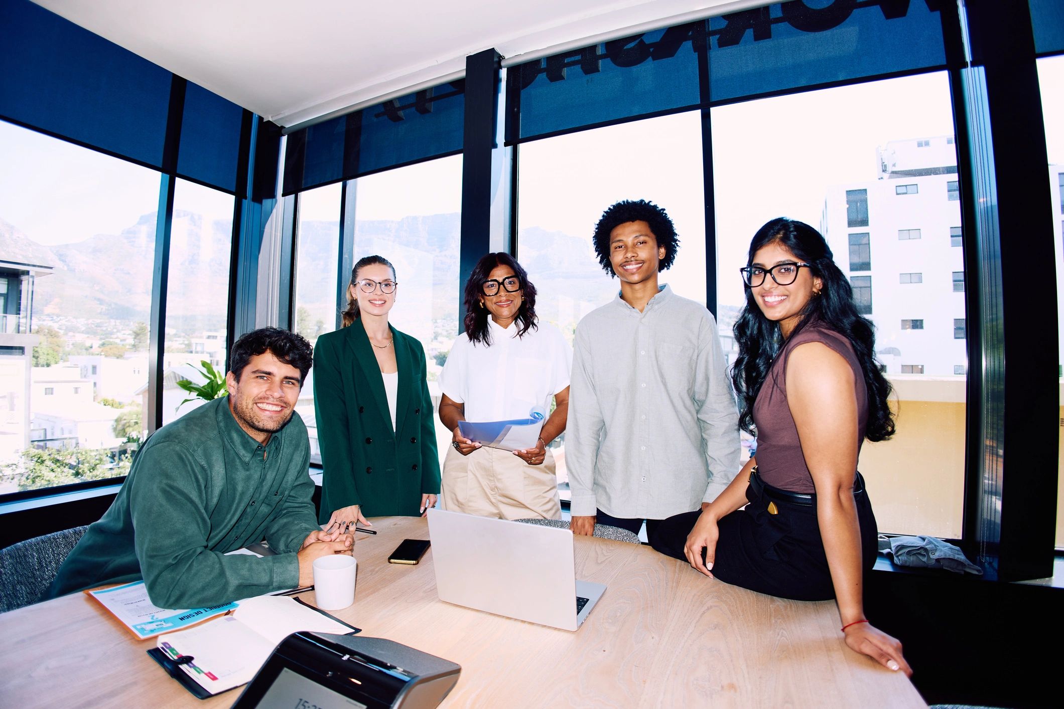 Professional business team gathered around a meeting table